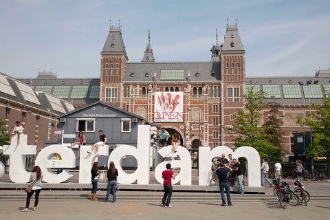 Banner with tulip on the Nachtwacht extension, at the front are a construction shack and letters of the logo I AMSTERDAM, 2011 Canvas Print