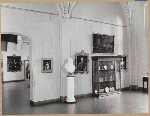 Room 114 seen to the west with paintings, a bust and a display cabinet, 1963 Canvas Print