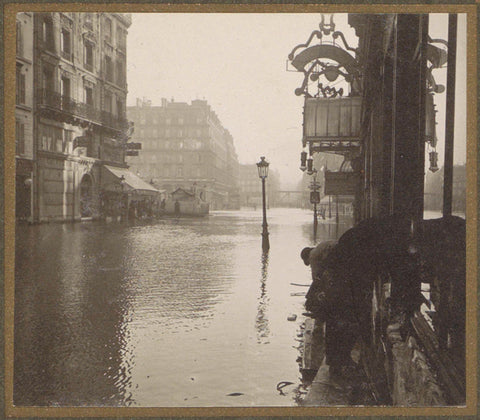 Pedestrians on a plankier in a flooded street, G. Dangereux, 1910 Canvas Print