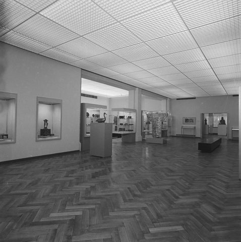 Room with showcases, a bird on a pedestal, a kimono and two statues at the back, 1983 Canvas Print