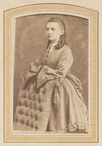 Portrait of a young woman in a dress leaning on a chair, De Lavieter & Co., 1870 - c. 1900 Canvas Print