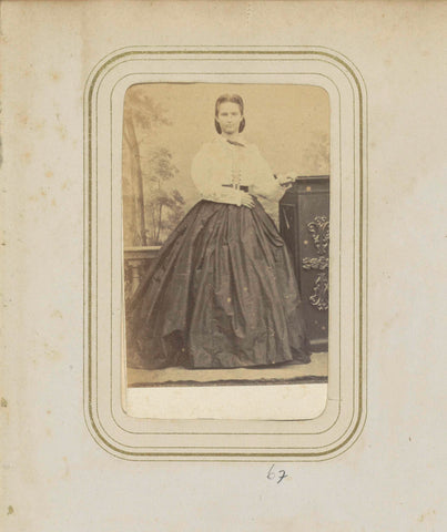 Portrait of a woman in a wide skirt and a white blouse, anonymous, c. 1860 - c. 1880 Canvas Print