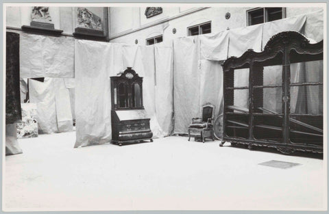 Furniture including cupboard and armchair against a background of sheets of paper or rags of fabric, 1957 Canvas Print