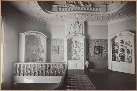 Room with three display cabinets with Chinese porcelain, in between hang two portraits, c. 1920 - c. 1950 Canvas Print