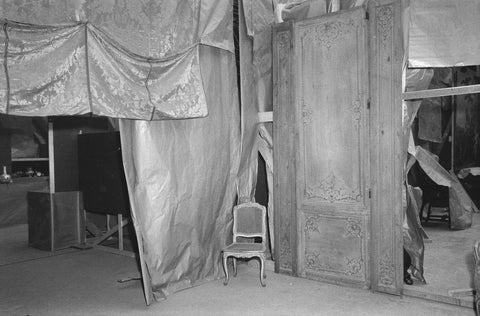 Paneling with armchair against background of sheets of fabric or sheets of paper, 1957 Canvas Print