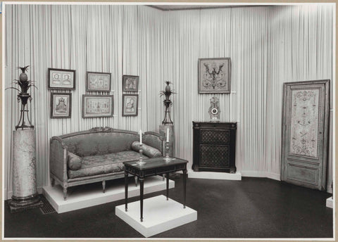 Corner of a room with furniture, paintings and a carved door, c. 1957 Canvas Print