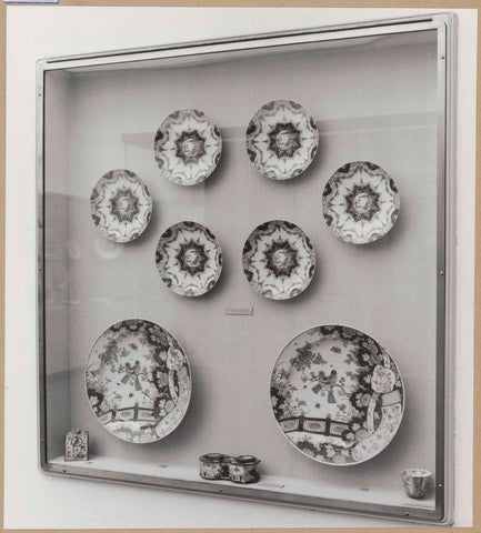 Display case with ceramic objects, including plates, c. 1959 Canvas Print