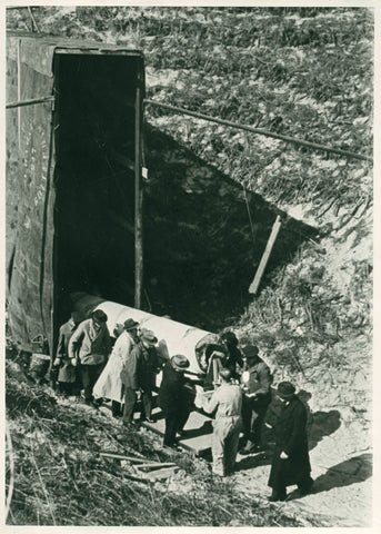 Men transport rolled up canvas from air raid shelter, 1939 - 1941 Canvas Print