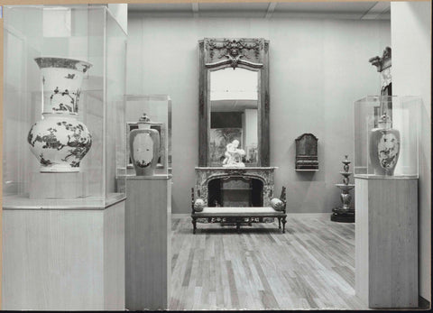 Room with vases in display cases and a view of the room with a fireplace with mirror and a rest bench, 1962 Canvas Print