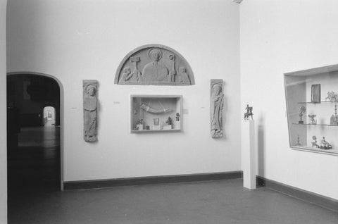 Room with arrangement Medieval Arts and Crafts: reliefs, statue on pedestal, display cases and passage, 1952 Canvas Print