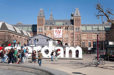 Banner with tulip on the Nachtwacht extension, at the front are a construction site and the logo I AMSTERDAM, 2012 Canvas Print