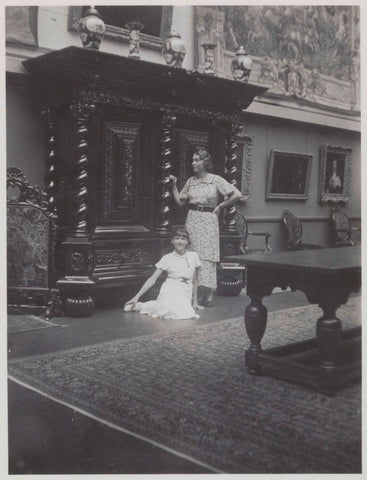 Two ladies pose in front of a large baroque cabinet in the western courtyard in 1936, 1936 Canvas Print