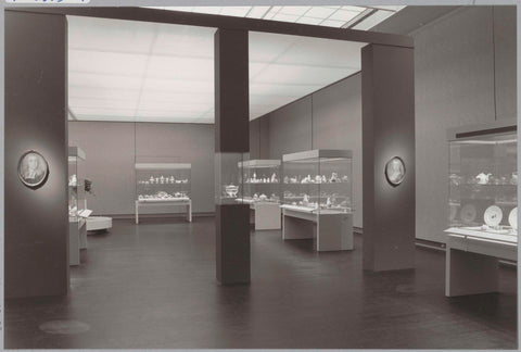 Room with various objects in display cases and portraits on pillars, c. 1988 Canvas Print