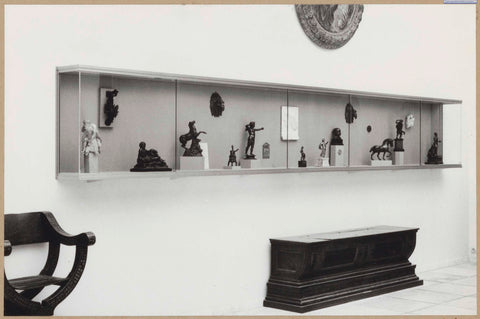 Corner of a room with chest, armchair and display case with statues, 1961 Canvas Print