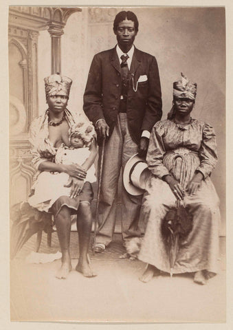 Studio portrait of a Western dressed African man with two women and a child, presumably in Cameroon, anonymous, c. 1890 - c. 1899 Canvas Print