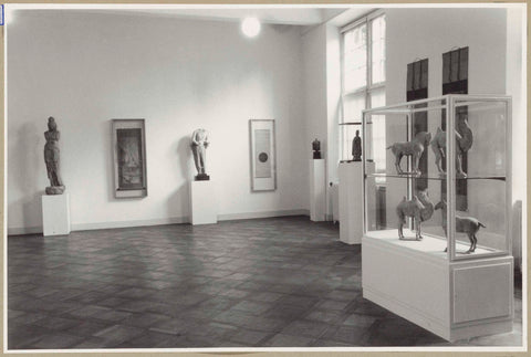 Room with sculptures, roll paintings and right front a display cabinet with camels and horses, 1952 Canvas Print