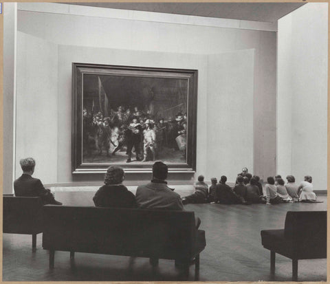 Night watch room with visitors sitting on benches and on the ground, seen from behind, 1960 Canvas Print