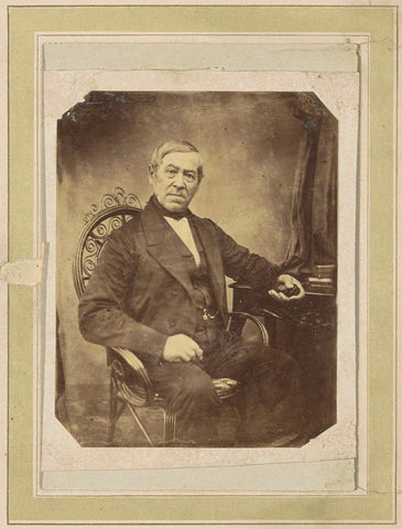 Portrait of a seated man with an object in hand, anonymous, c. 1870 - c. 1900 Canvas Print