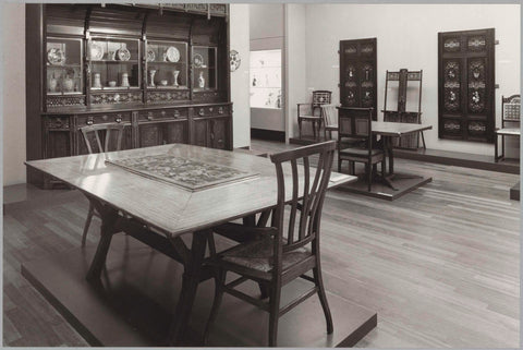 Room with furniture including, chairs, tables, cupboards, ceramics and (presumably) door panels, 1983 Canvas Print