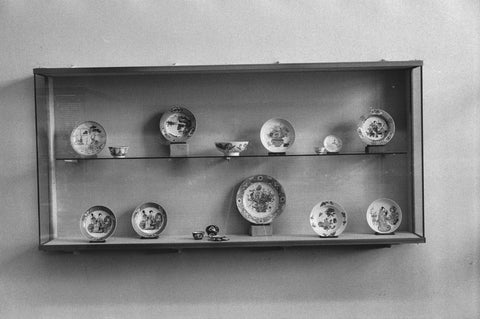 Display case with Chinese famille rose porcelain including plates, 1957 Canvas Print