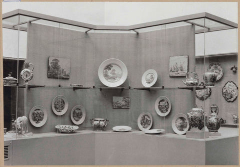 Display case with ceramic objects, including plates, a plate, a cow, a jug, pots and vases, c. 1959 Canvas Print