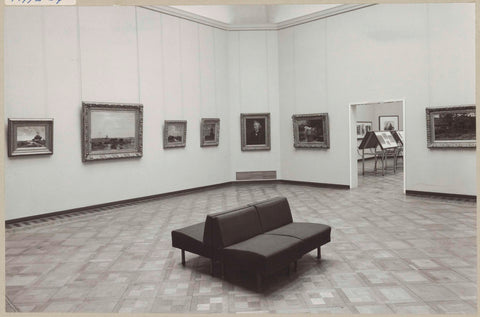 Room with seven paintings and a view to another room with oblique display cases, 1975 Canvas Print