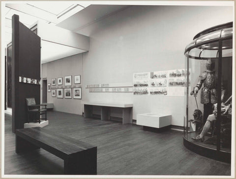 Room with various objects including prints, costumes, a harness, a chair, a bench for visitors and reclining information panels, c. 1978 Canvas Print