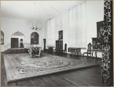 Room with wall and floor tapestries, paintings, furniture and a staircase leading to a passageway, 1957 Canvas Print