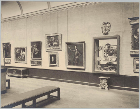 Room with paintings, low paneling and wall coverings, in the middle of the wall is a display case, 1934 Canvas Print