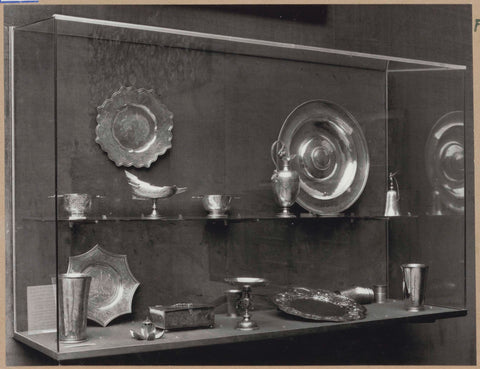 Display case with silver objects, including jugs, bowls and a box, c. 1959 Canvas Print