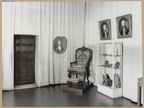 Room 115 seen to the southeast with portraits, a display case and a chair, 1963 Canvas Print