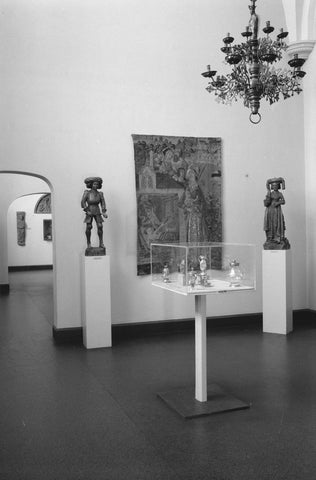 Room with 15th and 16th century crafts: sculptures on pedestals, chandelier, display case and two passageways, 1953 Canvas Print