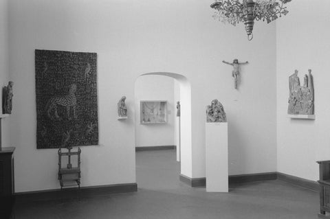 Room with statues including a crucifix, tapestry and passage, 1952 Canvas Print