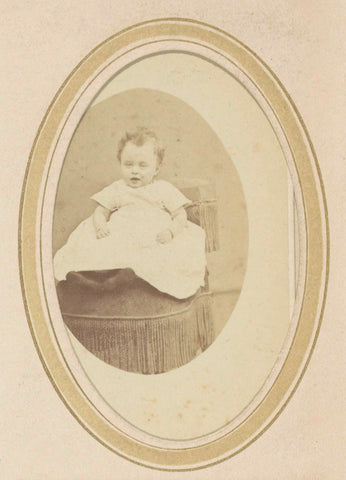 Portrait of a baby in a dress on an armchair, anonymous, c. 1860 - c. 1900 Canvas Print