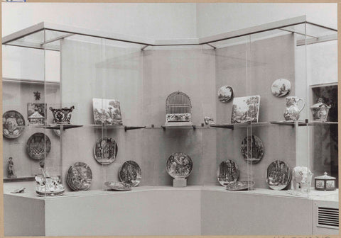 Display case with ceramic objects, including plates, a violin, two plates, a cow and a birdcage, c. 1959 Canvas Print