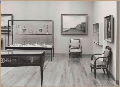 Room with a display case with silverware, paintings, furniture including chairs and a musical instrument, 1962 Canvas Print