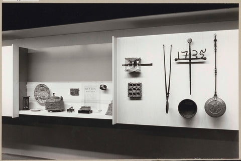 Display case and panel with various objects, 1971 Canvas Print