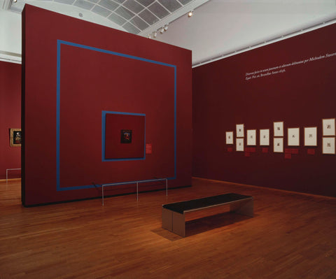 Room with various works, a red partition wall, a sofa for visitors and a Latin text on the wall, c. 2002 Canvas Print