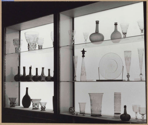 Display cases with various objects of glass and/or crystal including bottles and drinking glasses, c. 1959 Canvas Print