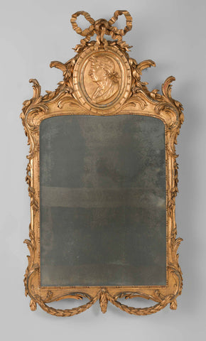 Mirror in gilded and carved frame with, among other things, an oval medallion with an award-winning man's head accustomed to the left as a weapon piece of the 't Hooft family, anonymous, 1780 Canvas Print