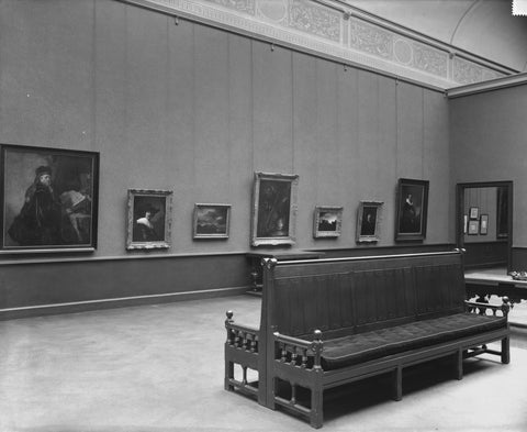 Room with paintings, two tables, two opposite benches and a passage on the right, 1935 Canvas Print