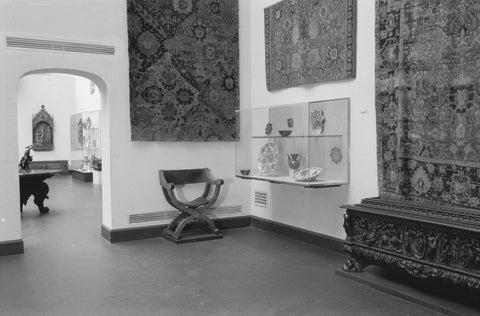 Room with tapestries, display case, chair and passageway, 1953 Canvas Print