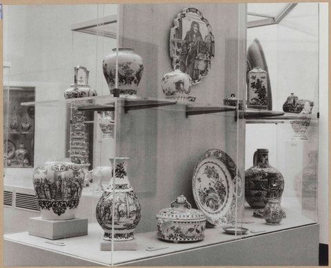 Display case with ceramic objects, including a bowl, vases and a plate, c. 1959 Canvas Print