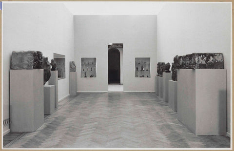 Room with sculptures on pedestals and three built-in display cases, at the back a passage, 1952 Canvas Print