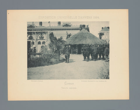 View of a group of unknown Congolese men in uniform with rifle at the pavilion of Congo during the World Exhibition of 1894 in Antwerp, Charles Bernhoeft, c. 1894 Canvas Print