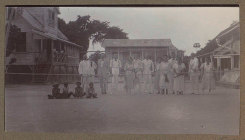 Company with tennis rackets on a tennis court in Suriname, anonymous, 1923 Canvas Print