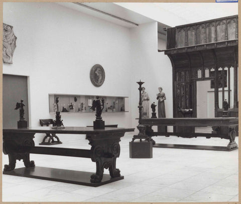 Corner of a room with various objects, including sculptures, majolica, a choir gate and furniture, c. 1961 Canvas Print