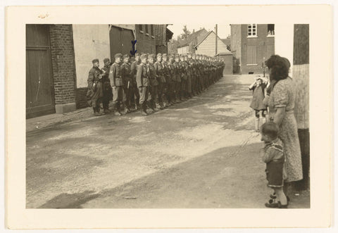 Group of German Wehrmacht soldiers in a village, anonymous, 1940 Canvas Print