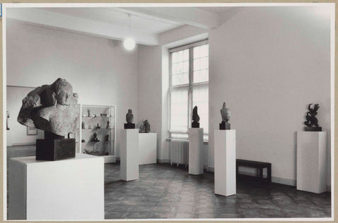 Room with statues on pedestals, at the back a display cabinet next to a passage, on the right a window, 1952 Canvas Print