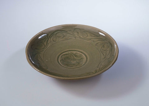 Saucer-dish with incised floral and foliate scrolls, anonymous, c. 1100 - c. 1199 Canvas Print